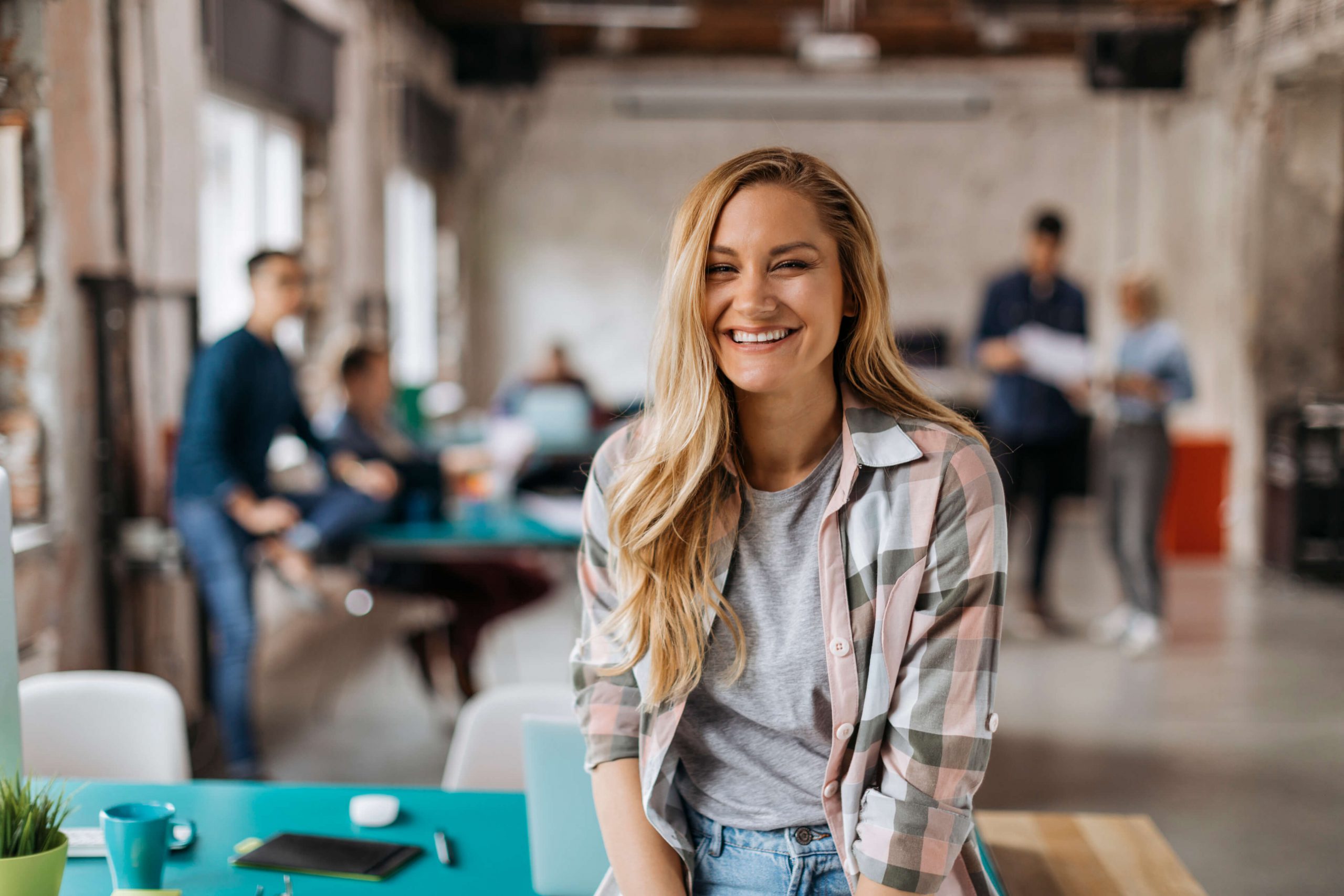 blonde woman grinning at camera